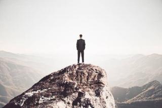 Umělecká fotografie Businessman standing on mountain, peshkov,