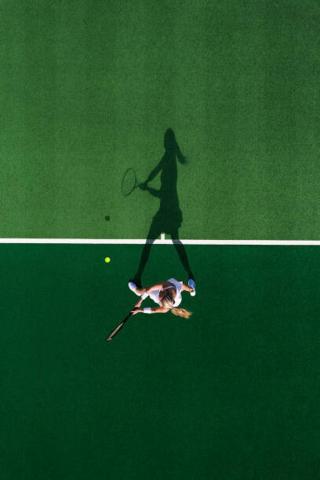 Umělecká fotografie Drone shot above a female tennis, Abstract Aerial Art,