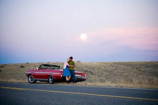 Umělecká fotografie man and woman next to a red convertible, Mike Kemp,