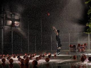 Umělecká fotografie Man shooting basketball at night in, Adam Weiss,