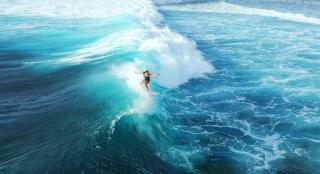 Umělecká fotografie Surfer woman riding on the blue ocean, graphixel,