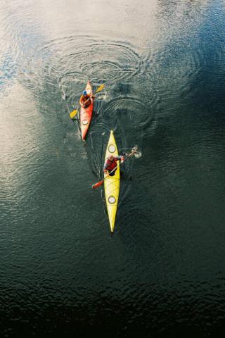 Umělecká fotografie Two men are kayaking along the river., Vitalalp,