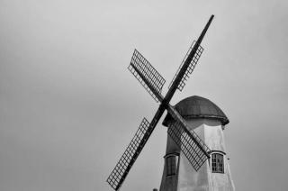 Umělecká fotografie View of a windmill on a cloudy day, Niklas Storm,